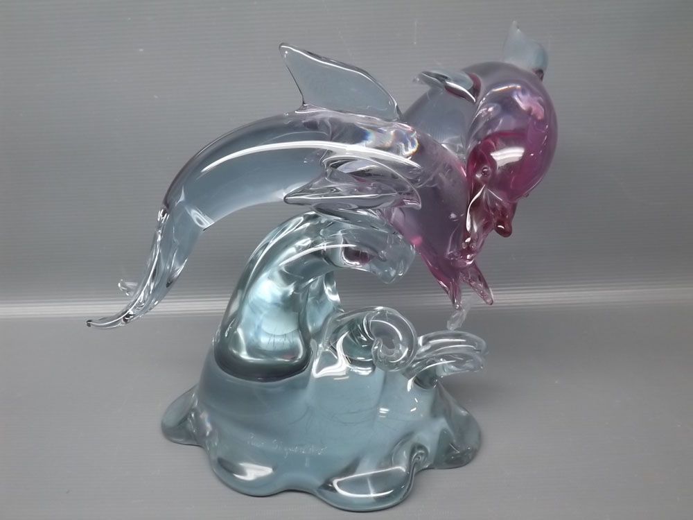 20th century coloured glass model of dolphins leaping out of the waves, signed to the foot "Pino