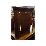 Early 19th century oak corner cupboard, with moulded and dentil cornice, to a single panelled door