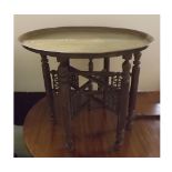 20th century folding Benares tray and stand, with circular etched tray and pierced folding stand,