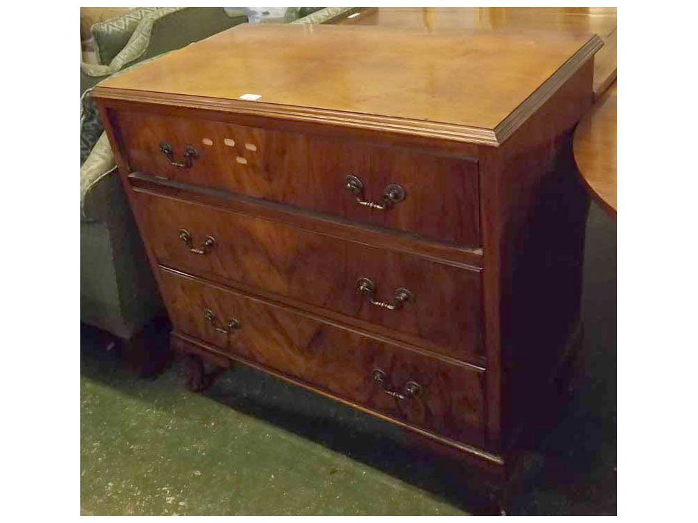 Early 20th century walnut chest of three drawers, with quarter veneered top and brass handles, on