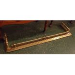 Victorian brass fender, with twisted rail and knob top, 52 ins wide x 14 1/2 ins deep