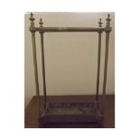 Victorian brass 8-sectional coat stand, with cast iron base and knobbed finials, 15 1/2 ins x 9