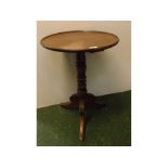 Early 20th century mahogany circular topped wine table with turned and knobbed column, supported