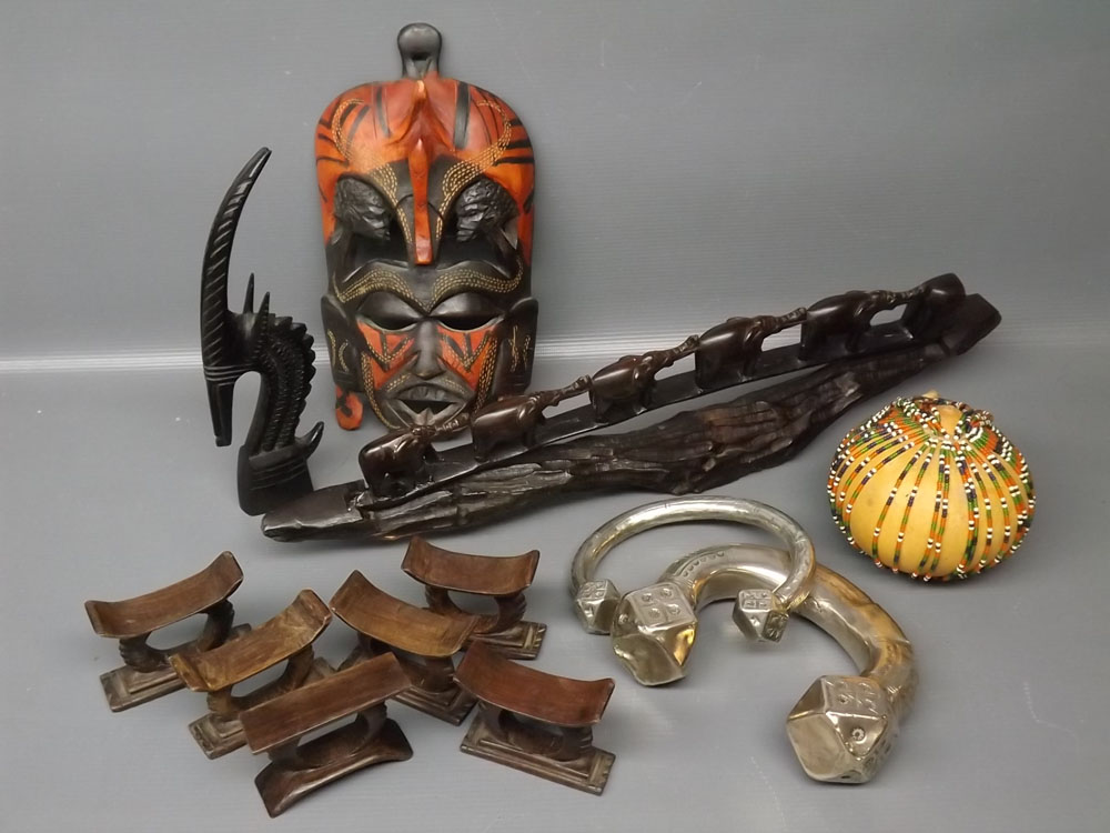 Group : African mask, set of six carved wooden napkin rings, carved wooden elephant bridge, beaded