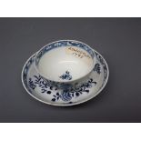 18th century English tea bowl and saucer, decorated in underglaze blue