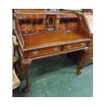 Reproduction mahogany desk with fitted and shelved pigeonhole interior, with two drawers supported