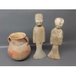Two Oriental pottery figures together with a further bulbous two-handled vase with rust coloured