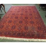 Late 20th century Caucasian style carpet with diamond lozenge centre, mainly red field A/F, 11ft