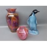 Poole Pottery model of a standing penguin with underglazed blue detailing, together with a further