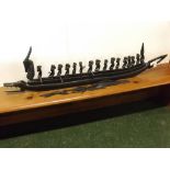 Collection of various ebonised tribal items includes model of a boat etc