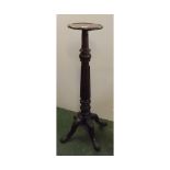 19th century mahogany torchere stand with circular top and reeded column, supported on a