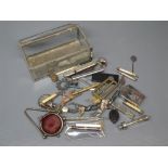 Metal and glass case containing various lead figures, vintage pen knife, lighter, cigar cutter etc
