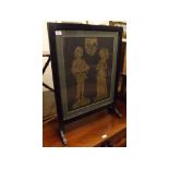 20th century black painted fire screen, of plain rectangular form and inset with a brass rubbing