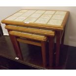 Nest of three teak framed, tile topped occasional tables, largest 21 ins x 13 ins (3)
