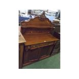 19th century mahogany chiffonier, top fitted with shaped shelf and carved central relief with