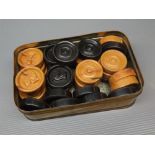 Cased set of unusual composition draughts pieces