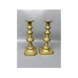 Pair of Victorian brass candlesticks on shaped rectangular bases, 9" tall (2)