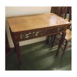 20th century mahogany silver style table, with pierced fretwork frieze supported on four carved claw