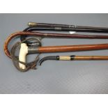 Collection of various lacquer ebonised and other walking sticks and canes