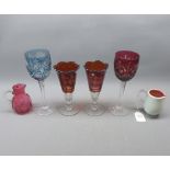 Cranberry and blue cut glass clear stemmed wine glasses together with a further pair of Bohemian