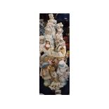 Group containing 19 assorted Continental figures decorated in colours, tallest 10" high