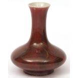 Chinese Sang de Boeuf flamb glazed vase of compressed form with shades of lavender inclusions, 7 1/2
