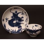 A Lowestoft tea bowl and saucer c1770 decorated with the dragon pattern, the sinuous dragon