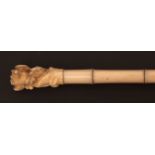 Early 20th century parasol, the sectional ivory handle carved with motif of monkey and a rat,