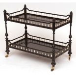 19th century two tier trolley/coffee table, of ebonised construction with ivory mounts, raised on