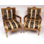Pair of gilt wood and gesso Louis Quinze style armchairs, upholstered in printed Regency stripe