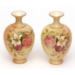 Pair of Royal Worcester blush baluster vases, typically painted with sprays of spring flowers,