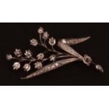 Precious metal diamond spray brooch, the twelve flower heads each set with a small single cut