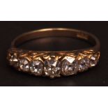 Antique 18ct gold seven-stone diamond ring, boat shaped with seven graduated mixed old cut