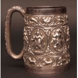 Late 19th century Indian white metal tankard, of tapering cylindrical form with hollow cast and