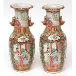 Pair of Chinese Canton porcelain vases decorated in typical famille rose enamels with panels of