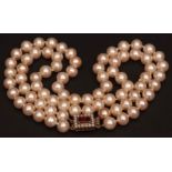 Cultured pearl necklace, a double row of uniform cultured pearls (7mm app) to a 9ct gold seed