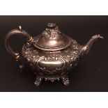 Victorian tea pot of compressed circular form with hinged and domed cover, surmounted by cast and