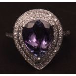 Modern precious metal diamond and tanzanite ring, the central pear cut tanzanite (4.45ct approx) set