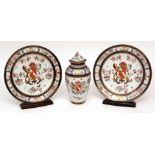 Samson garniture of two armorial plates and a covered baluster vase of tapering form, all painted in