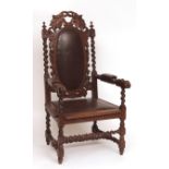 Victorian oak carver or throne chair, elaborately carved and crested with twining foliage, twisted