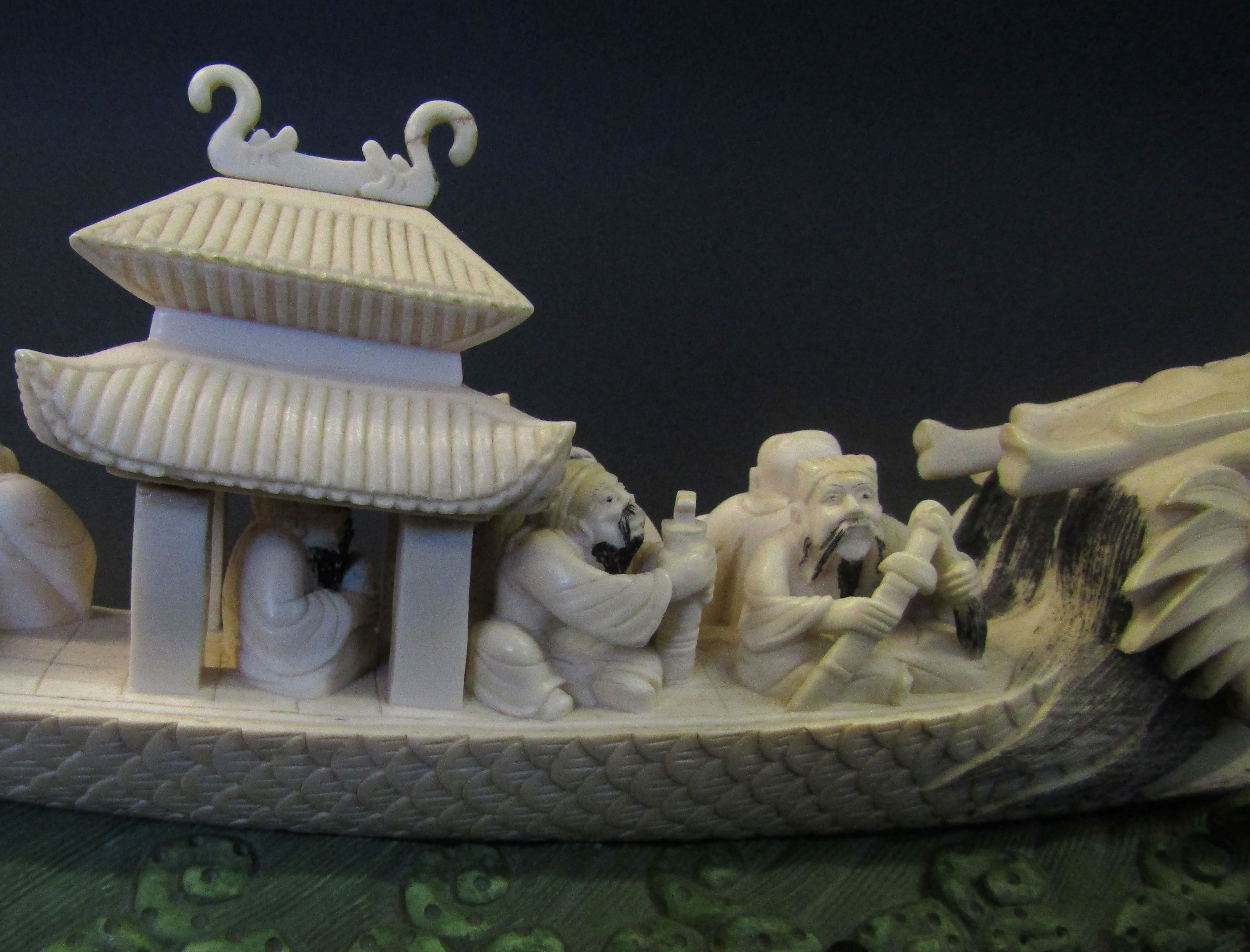 Chinese ivory carving of the lucky gods aboard a dragon pleasure boat set upon a green stained - Image 6 of 11