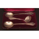 Victorian cased set of serving spoons and a sifter spoon, all with single sided chased and pierced