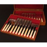 Late 19th century oak cased set of 12 each fish knives and forks, each with engraved blades and