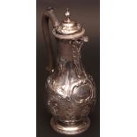 Victorian hot water pot of baluster form with hinged and domed cover and cast and applied finial and