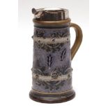 Royal Doulton cylindrical jug by George Tinworth, the hallmarked silver rim inscribed "The CCC