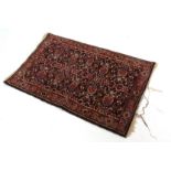 Small 20th century prayer rug, single gull border and central panel of floral designs, mainly dark
