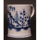 A rare early Lowestoft mug c1762 thickly painted in light blue with a Chinese landscape scene with