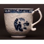 A Hughes type Lowestoft cup c1764 crisply moulded with flowers within tapering lattice panels