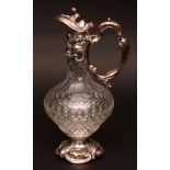 20th century electro-plate mounted and clear cut glass claret jug, the integral collar, handle and