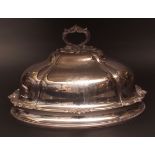 19th century large silver on copper meat cover of lobed oval form with flared base and applied